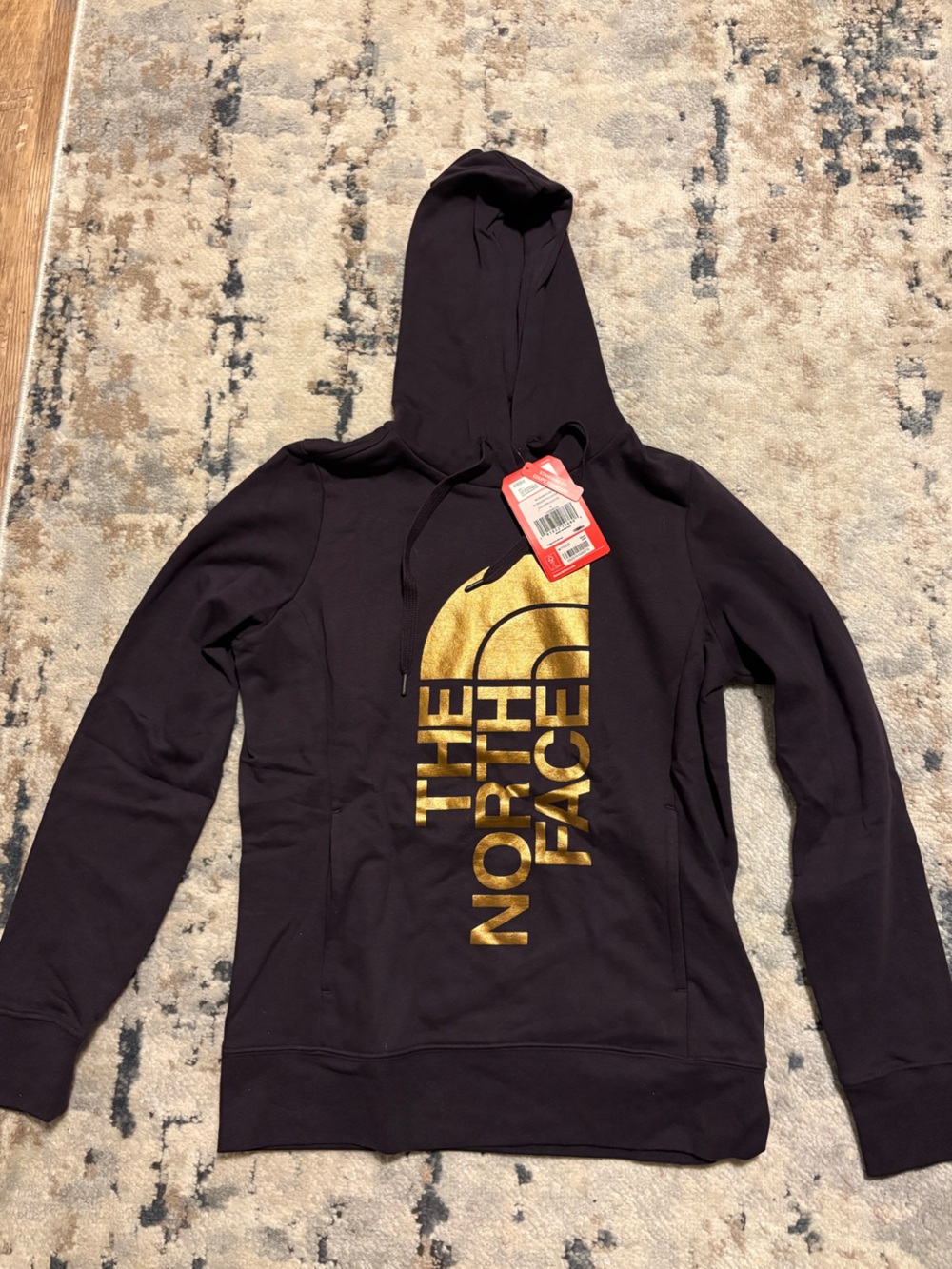 The North Face Purple Hoodie with Metallic Gold Logo